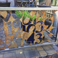 reclaimed cnc scrap negative space numbers for fence panel