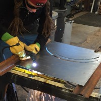 Sally working with plasma, cutting